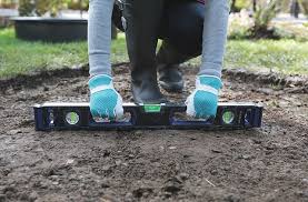 Digging a hole for a fire pit. Diy Patio Block Fire Pit A 5 Step Guide Rona