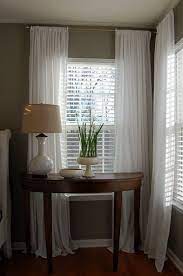 To dress up a large bay window, consider skipping curtains or blinds altogether and opting instead for a privacy screen. Master Bedroom Nesting Place Curtains Living Room Window Treatments Bedroom Home