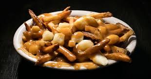For the gravy, toss the chicken wings in 1 tbsp of the flour, then heat the oil and butter in a large pan. The Absolute Best Poutine In Nyc