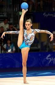 Rhythmic gymnasts are athletes possessing immense strength, speed, skill and flexibility, but they are also artists capable of profound and expressive beauty. Yulia Barsukova Russia Was The Oldest Olympic Champion In Rhythmic Gymnastics 21 Years Untilevgenia Sport Gymnastics Rhythmic Gymnastics Gymnastics Girls