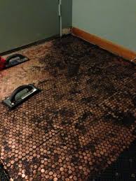 Here, we talk you through how easy it is to make an epoxy penny floor yourself. Make A Floor Out Of Real Pennies Step By Step Pretty Purple Door Penny Floor Floor Installation Penny Backsplash