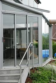 Wintergarten Schiebeelemente In Weissaluminium Und Weiteren Grautonen Wintergarten Schiebeelemente Fenster Und Turen