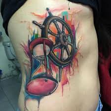 See more ideas about tattoos, watercolor tattoo, tattoo artists. Watercolor Hourglass And Sailor Wheel Tattoo On Side Rib