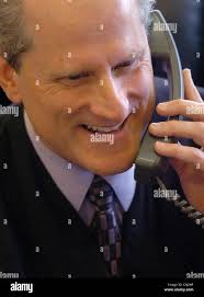 SECOND PHOTO -- The Honorable James Mize laughs when a caller is surprised  he is answering his own phone, which he blames