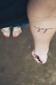 40 Minimalist One Word Tattoo Ideas That Are Beautiful On Every Woman Forearm Tattoos Tattoo Fonts Joy Tattoo
