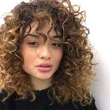 Experts generally recommend curly bangs to be longer than straight ones, so the naturally voluminous and bouncy hair falls over your face and stays in place. Natural Curly Hair Bangs Hairstyles Novocom Top