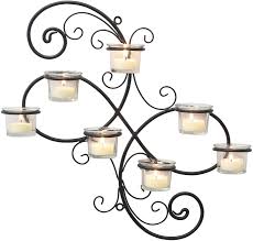 Wall candle sconces are those tarnished brass things that have hung in your grandma's living room for centuries. Amazon Com Stonebriar Br Cn 5387a Decorative Black Scrolled Ivy Metal Tea Light Candle Holder Hanging Wall Sconce 7 Tealight Home Kitchen