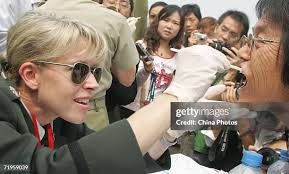 Daria Lopez-Alegria and her son Nicolas Lopez-Alegria watch live TV... News  Photo