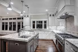 Dark granite countertops and white kitchen cabinets are a classic combination. Kitchen With Granite Counters And A White Finish Kitchen Cabinet Design White Granite Countertops Kitchen Remodel