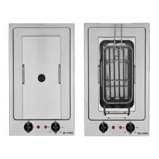 Stunning extra light gray kitchen cabinets accented with brass hardware and a white marble countertop fitted with a shallow apron sink and a brass kohler karbon faucet mounted in front of a half tiled marble herringbone backsplash beneath a window. Sami Kotob Trading Est Kotob City