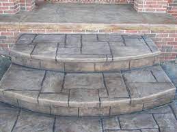 Get to know what a stamped concrete is, its interesting history, as well as the process of stamping concrete that involves base color, accent color, stamping patterns, and more. Concrete Steps Ferrazza Cement Construction