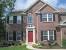 Small Red Brick House With Black Shutters