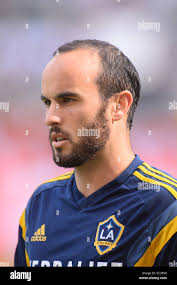 New England Revolution midfielder Joe Franchino, left, fights for control  of the ball with Colorado Rapids midfielder Matt Crawford, right, as  Revolution forward Clint Dempsey closes in from behind in the first