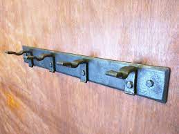 Flat Hook Rack A Rack Of Four Hand Forged Wall Hooks Ideal Etsy Forging Blacksmithing Wall Hooks