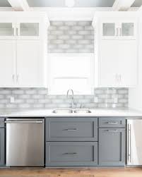 Two Tone White And Dark Gray Shaker Cabinets With Gray Subway Tile Backsplash And Light Hardwo In 2020 Kitchen Cabinet Styles Diy Kitchen Renovation Lake House Kitchen