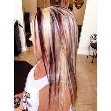 Use a curling iron to create curls that will let the purple highlights shine through. Highlights With Red Violet Lowlights By Brittany At Stouts Salon In Knoxville Tennessee Blonde Red Hair With Blonde Highlights Long Hair Color Red Blonde Hair