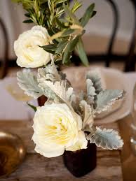 Bride holding yellow bouquet for wedding at mystical rose gardens in baldwin, wisconsin. Winter Wedding Flowers Hgtv