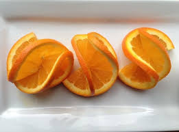 How To Make A Fancy Double Orange Twist Garnish Canadian Living Food Garnishes Drink Garnishing Fruit Garnish