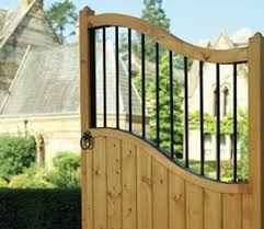 I'm using those clips that let you attach 2x4s horizontally to the metal posts. Wooden Gates Metal Gates Direct