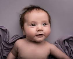 Lying Child in Purple Clothes · Free Stock Photo