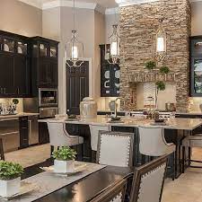 Groups really are a good way to decorate your kitchen. Taupe Walls Dark Cabinets Stone Wall Kitchen Design Beautiful Kitchens Kitchen Remodel