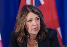 Premier Danielle Smith defends new COVID shot administration fee during  radio show