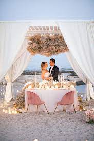 Beach Vow Renewal In Greece With Clouds Of Baby S Breath Ruffled Vow Renewal Beach Wedding Renewal Vows Destination Wedding Decor