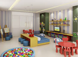 Form Study Room With Modern Decor Of This Child Tables And Chairs Blue And There Is A Pool Of Plastic Balls Kids Bedroom Designs Playroom Design Kids Playroom