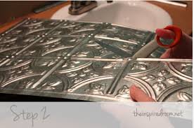 Adding a tin backsplash is a quick and easy way to update your kitchen space and is one of our most popular diy projects. Diy Faux Tin Ceiling Tile Back Splash The Inspired Room