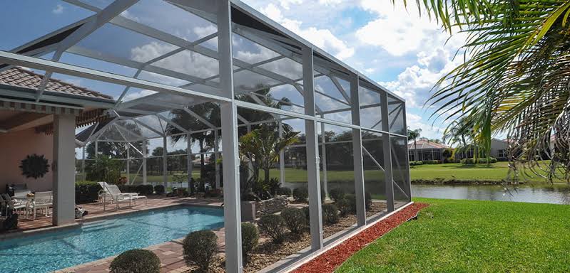 Custom patio screen enclosures provide seamless views while keeping pests and debris out., AI generated