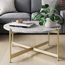 Stunning white concrete coffee table makes a statement in any living room. Amazon Com Nathan James Piper Faux Marble Round Modern Living Room Coffee Table With Brass Metal Frame Gold Furniture Decor