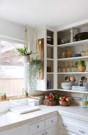 The shelf resembles a shallow drawer that glides out for easy access to items stored in the back of the cabinet. This Kitchen Cabinet Design Hack Is A Renter S Dream Simple Kitchen Cabinets Kitchen Cabinet Styles Open Kitchen Cabinets