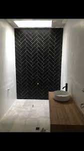 Here are some unique ideas for using this tile in your. Matte Black Tile In Herringbone Bamboo Vanity Matte White Wall And Arkitek Grey Floor Bathroom Design Luxury Herringbone Tile Grey Flooring