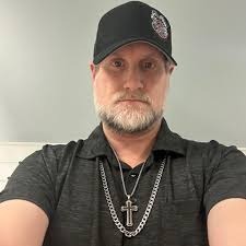 The graveside of Big John Studd — a true giant in every sense of the word.  Pictured there are his son Sean, Sean's wife, and their young child — Big  John Studd's