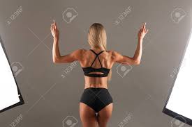 Jul 22, 2019 · several stabilizer muscles are also activated during the lunge to maintain your posture and stabilize your joints. Strong Athletic Woman Fitness Model Posing Back Muscles Triceps Latissimus Over Black Background In The Studio Athletic Young Woman Showing Muscles Of The Back And Hands Stock Photo Picture And Royalty Free