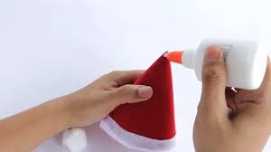 Then cut the yarn along the top and bottom edges of the book. 3 Ways To Make A Santa Hat Wikihow