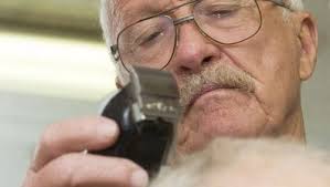 Barber 'Boots' Hooker uses his scissors to help local veterans