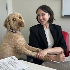 Chief barking officer Rusty giving Jessica Litt, CMAC's membership ...