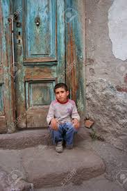 Poor boy (plural poor boys). Poor Boy Sitting In Front Of His House Stock Photo Picture And Royalty Free Image Image 5130704