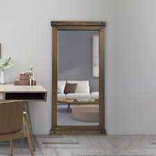 A 19th century antique trumeau mirror in parcel gilt finish with original split mirror plate and carved wood pediment. Antique Full Length Mirror