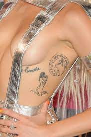 This look is giving us all the right vintage vibes. All Of Miley Cyrus Tattoos Miley Cyrus Tattoos And Their Meaning