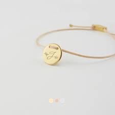 Available in a large selection of shapes, colors and styles, our special charms are the perfect choice to add to a charm bracelet, start a new one or enhance necklaces, chains and bangles with a personalized, custom flair. Delphine Delicate Custom Engraved Bracelet With Initial And Wreath Judith Jules