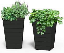For more unique plants, like vines and hanging flowers, consider a stylish hanging planter to bring color and life to your porch or entryway. Amazon Com Keter Set Of 2 Resin Modern Outdoor Tall And Large Flower Drainage And Tapered Wood Look Perfect For Garden Pots Balcony Planters And Front Porch Decor 15 In W X 15