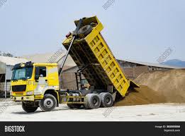 Ton, unit of weight in the avoirdupois system equal to 2,000 pounds ( 907.18 kg ) in the united states (the short ton ) and 2,240 pounds (1,016.05 kg) in britain (the long ton ). Ten Yard Dump Truck Image Photo Free Trial Bigstock