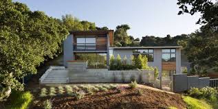 Modern home exterior with yellow wall balcony flat roof and large windows. 30 Stunning Modern Houses Best Photos Of Modern Exteriors
