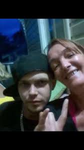 Could someone edit this picture and make it a little clearer please. It's  my friend and her son, he passed away very young.