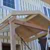 A portico is a covered entrance to a building supported by regularly spaced decorative columns. 1