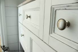 We started out by cleaning it with a vinegar and water solution to remove all dirt, grime, and a sticky spot we found. Powder Bathroom Vanity Makeover The Wood Grain Cottage