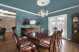 Your dining room paint color can set the tone for dinner parties and family gatherings, so it's important to consider what kind of mood you want to create. Elegant Dining Room With Slate Blue Walls Stock Photo Elegant Dining Room Brown Dining Room Dining Room Blue