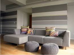 Just decide how thick you want the stripes to be, use painter's tape to mark off the borders, then fill in the lines with your desired color of paint. Now Those Are Some Stripes Striped Walls Living Room Living Room Paint Design Living Room Paint